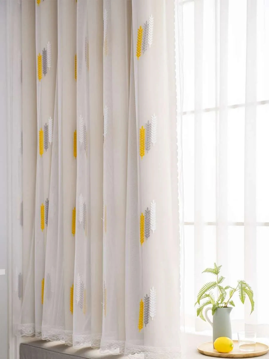 Elegant wheat field embroidered white curtain panels with yellow accents near a window.