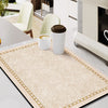 A beige kitchen drain mat with gold trim is shown on a marble countertop next to white cups.