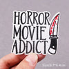 Black embroidered patch featuring the text Horror Movie Addict and a knife design.