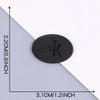 A black embroidered leather patch is shown against a white background with dimension markings.