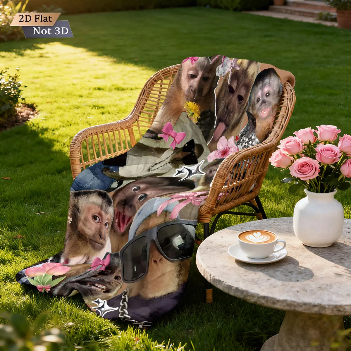 A funny monkey print flannel blanket is draped over a wicker chair in a sunny garden setting.