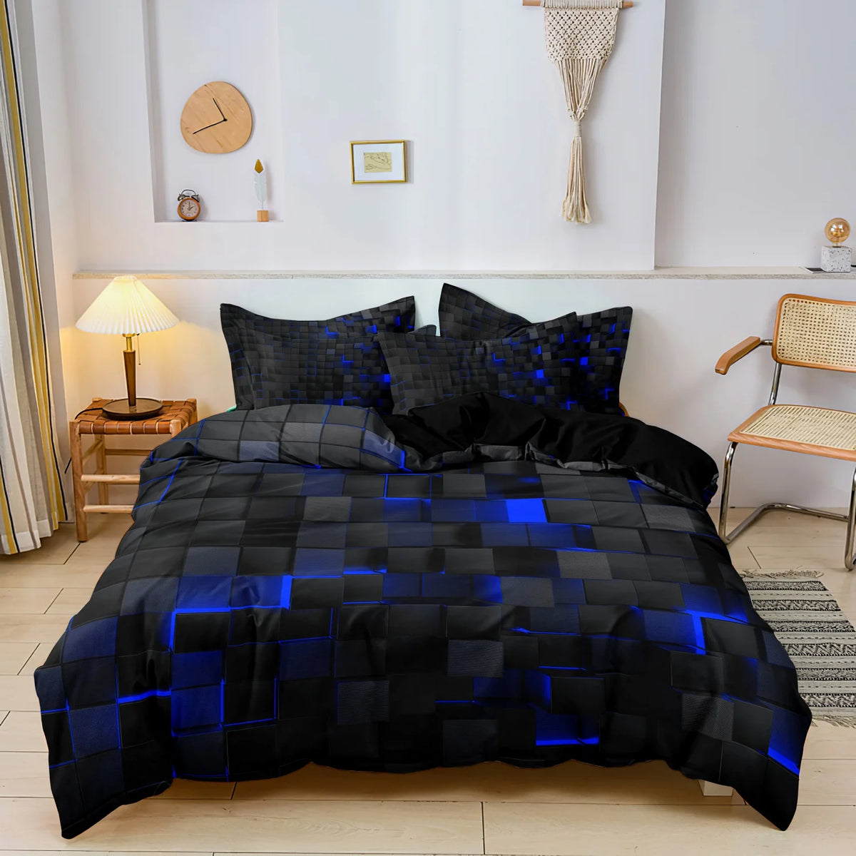 Black duvet cover with a glowing blue geometric grid print displayed on a bed.