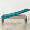 Teal velvet bench slipcover draped over a light gray upholstered bench.