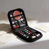 A black zippered case containing a multi-functional sewing kit with various tools and thread spools.