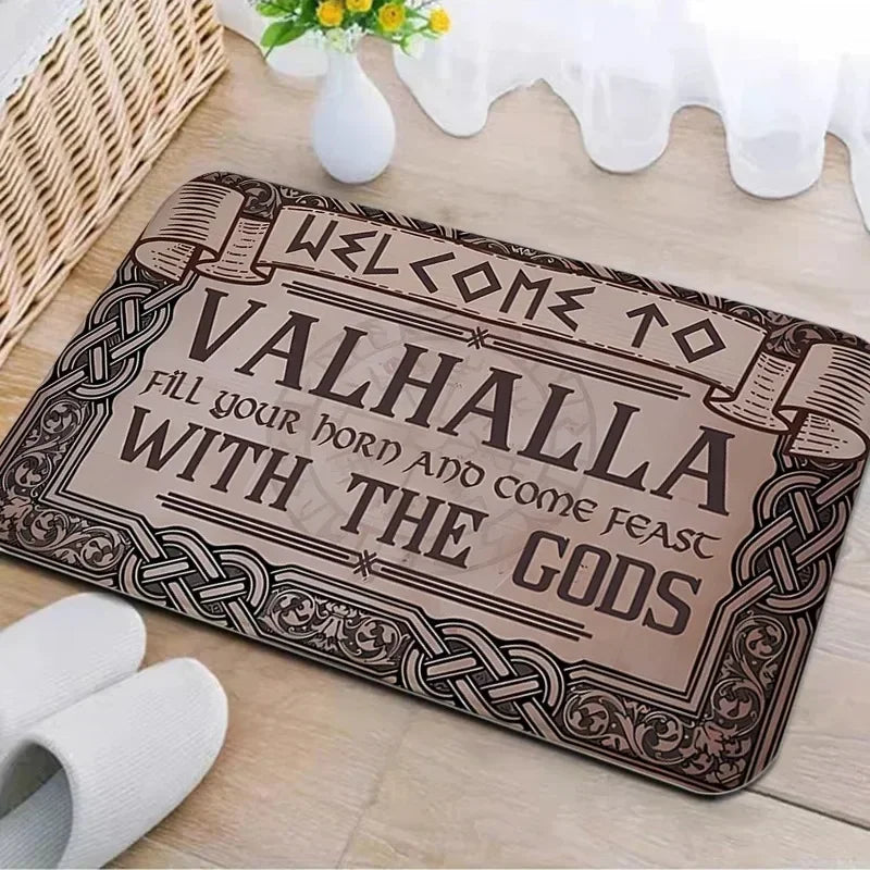 A rectangular entrance mat with a dark brown design featuring Celtic knotwork and the text Welcome to Valhalla fill your hoar