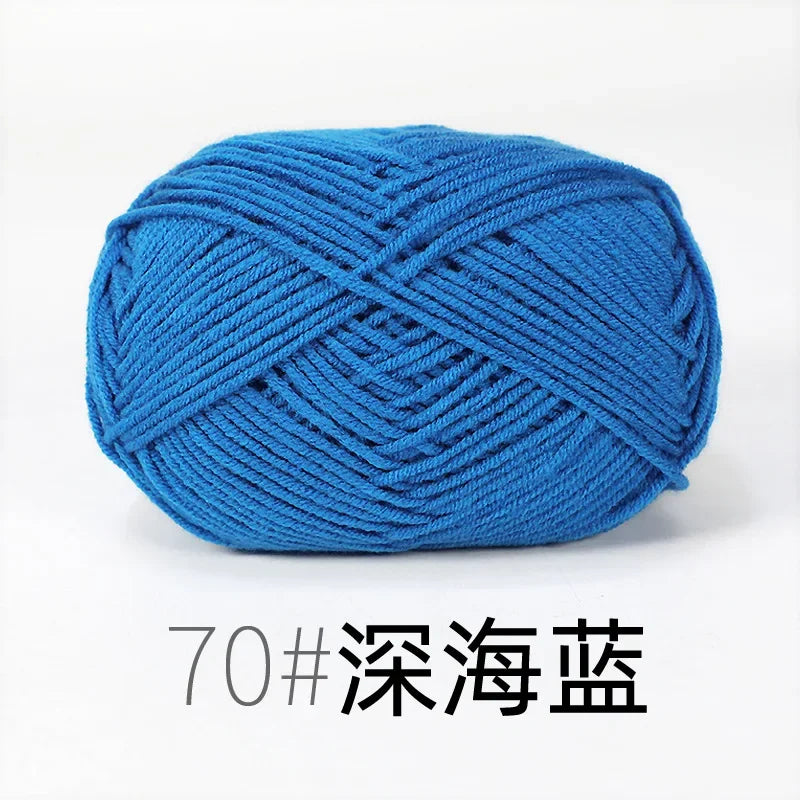 A ball of bright blue organic cotton 4ply knitting yarn for crafts.