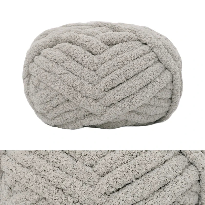 A light gray hand-knitted wool finger line scarf in a textured, ribbed pattern.