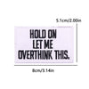 A rectangular embroidered patch with black text that reads HOLD ON LET ME OVERTHINK THIS.