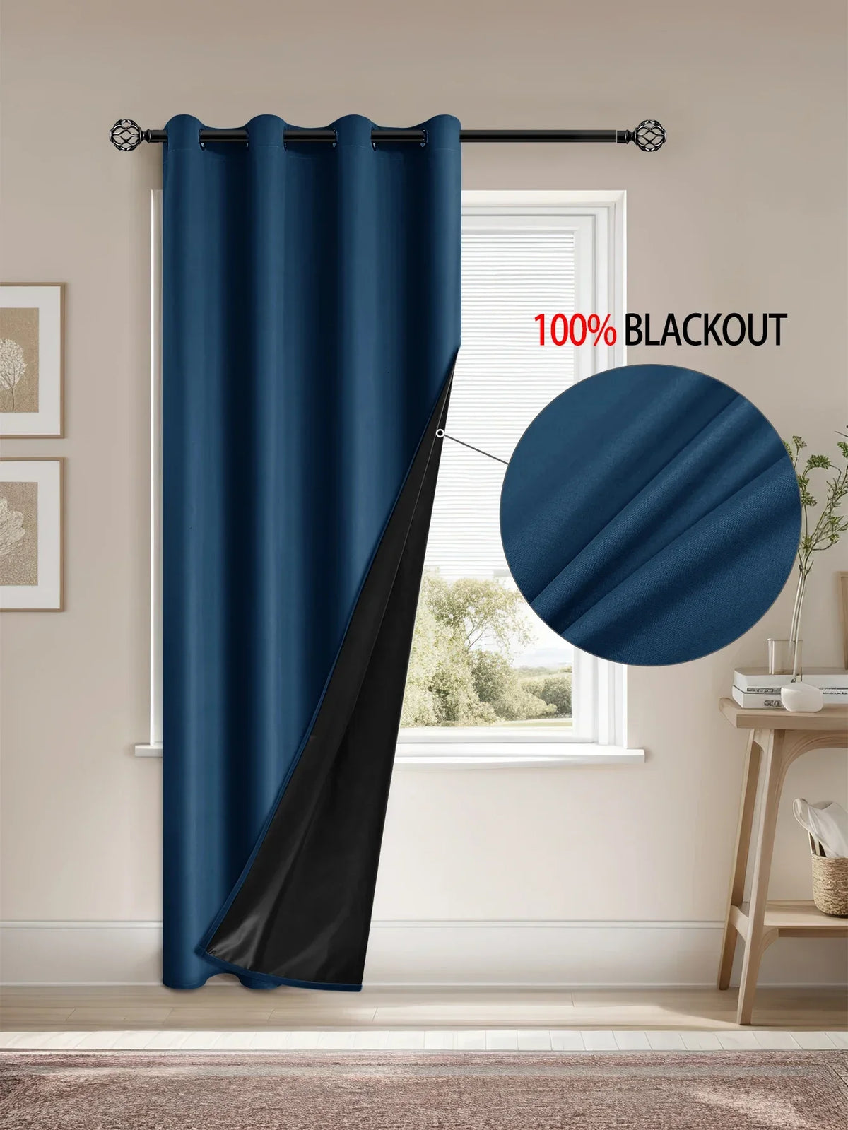 A dark blue blackout curtain hanging on a rod in a window frame.