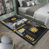 A black area rug featuring a creative dollar print design with gold accents and text.