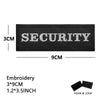 Black embroidered security patch measuring 3cm by 9cm with hook and loop backing