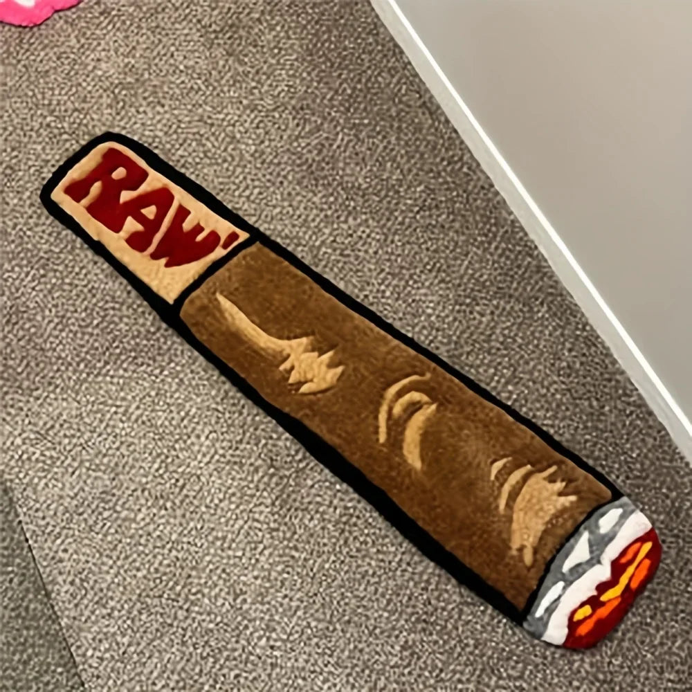 A rectangular brown floor mat with a red and yellow logo featuring a stylized knife design.