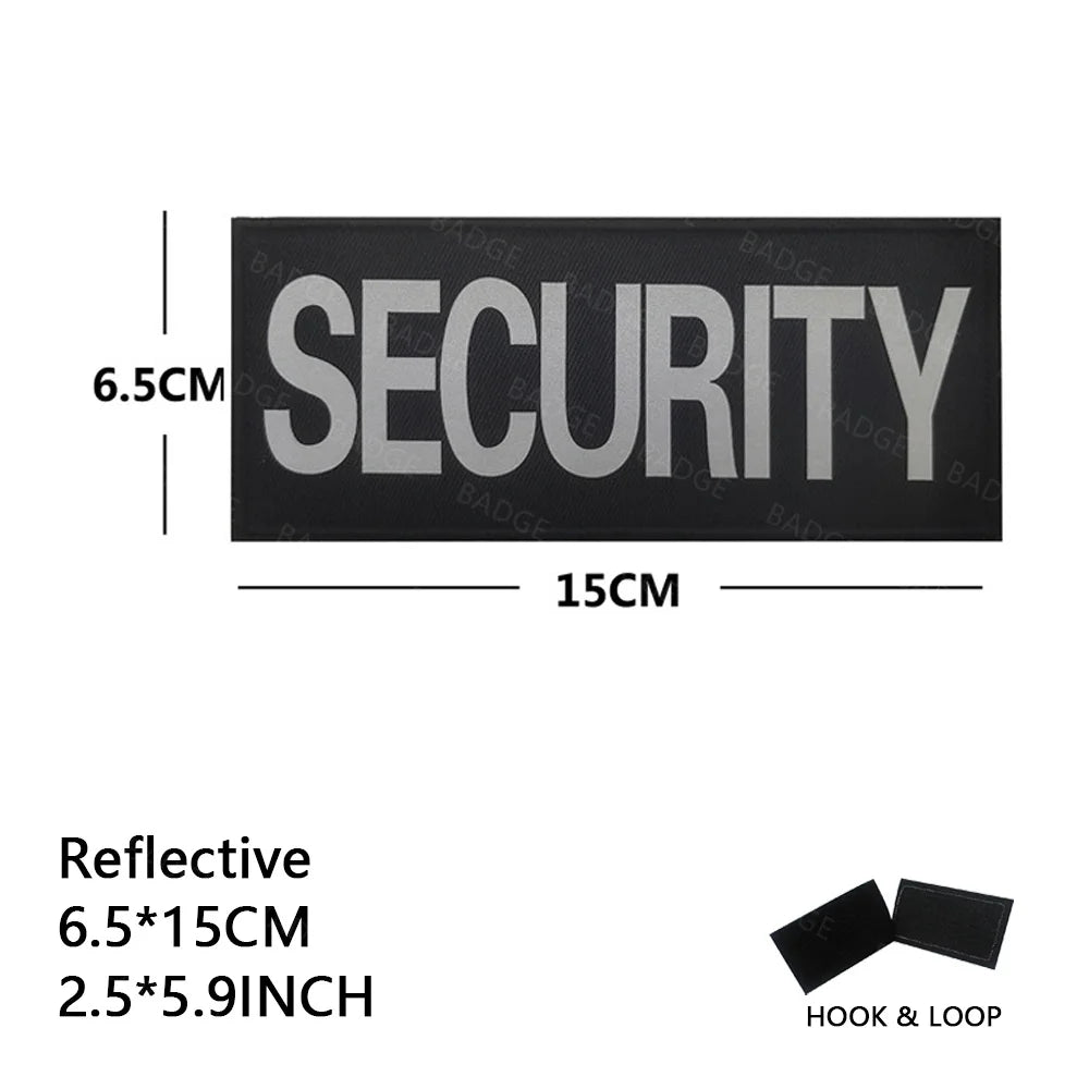Reflective security patch measuring 6.5cm by 15cm with a hook and loop closure