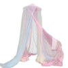 A sheer rainbow mesh mosquito netting canopy in shades of pink, blue, and white.