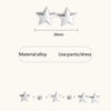 Silver star-shaped button clips used for pants or dress