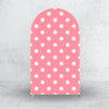 A pink arch backdrop cover with white polka dots, designed for party decorations.