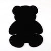 A black plush bear-shaped non-slip area rug.