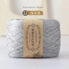 A skein of gray bamboo fiber yarn is shown, packaged with a label indicating 12 colors.