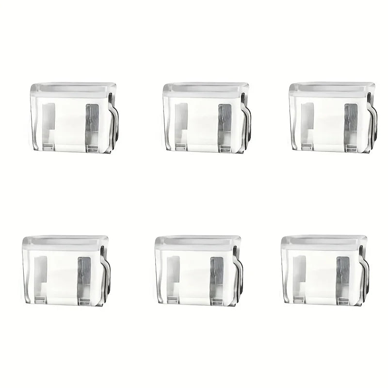 Four clear plastic invisible pants hem clips for non-slip length adjustment.