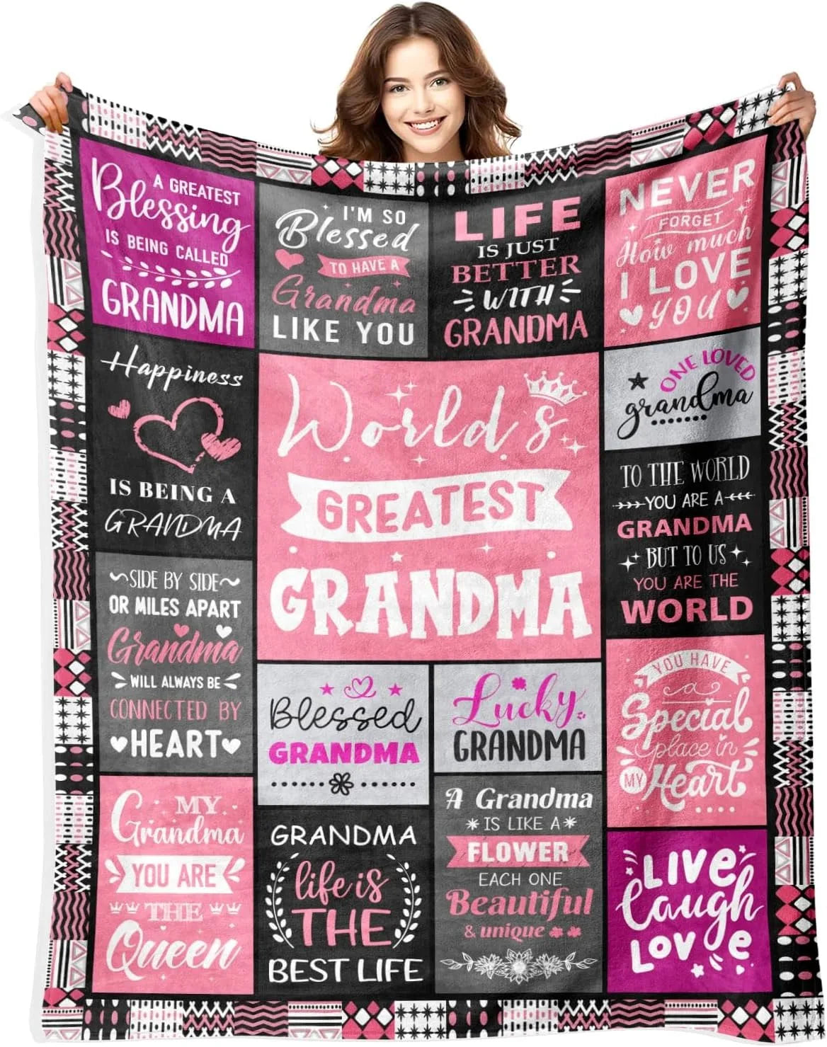 A women models a large pink and black patterned throw blanket featuring text about Grandma and blessings.