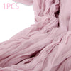 A light pink semi-sheer gauze fabric draped in soft folds.