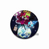 An enamel pin featuring a stylized, purple-skinned character with a crown and pink attire against a dark starry background.