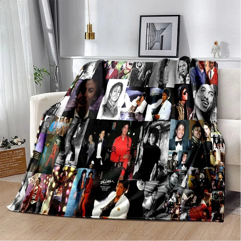 A dark flannel throw blanket featuring a collage of retro printed photographs and faces.