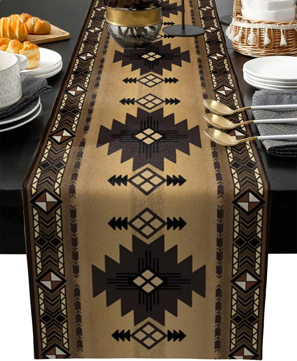 A tan linen table runner with an Indian-inspired geometric pattern featuring dark brown and gold accents.