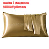 A golden satin pillowcase with an envelope closure, shown flat.