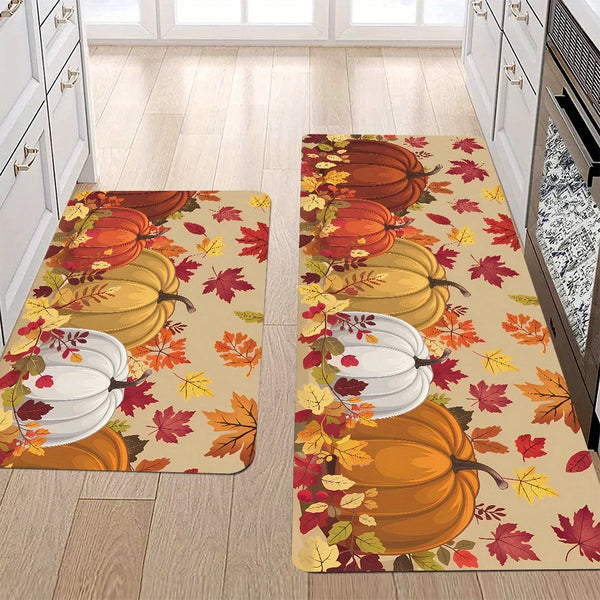 An autumn-themed area rug featuring pumpkins and maple leaves in orange, yellow, and red tones.