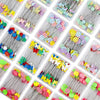 Assortment of nickel-plated dressmaking pins with colorful heads in clear plastic boxes.