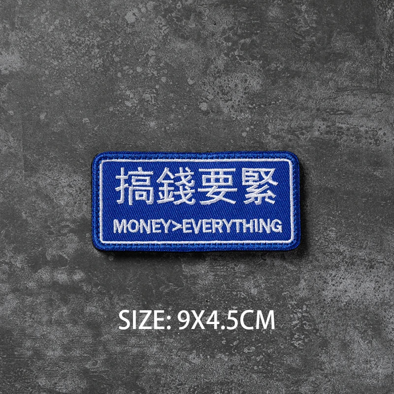 Blue rectangular badge with white Chinese text and English text on a gray textured background
