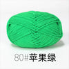 A ball of bright green organic cotton 4ply knitting yarn for crafts.