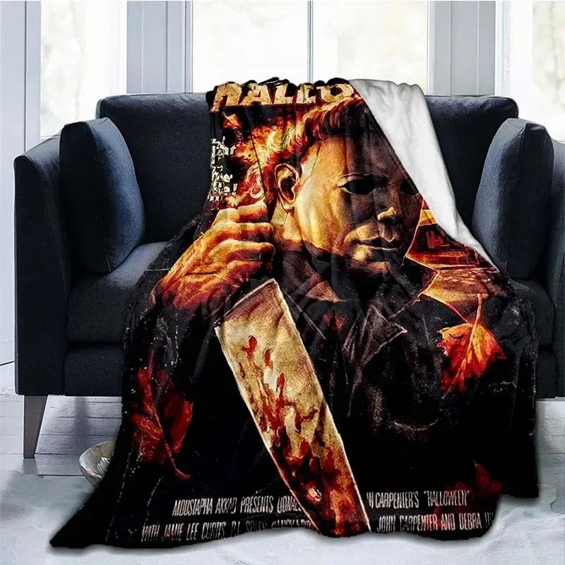 A dark horror themed throw blanket featuring a close-up of Michael Myers.