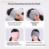 A close-up of a gray deep sleep gravity eye mask shown being worn by a woman, demonstrating its design and use.