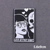 Black and white embroidery patch featuring a woman with heart-shaped sunglasses and a skull, with the text LOVE AT FIRST SIGH