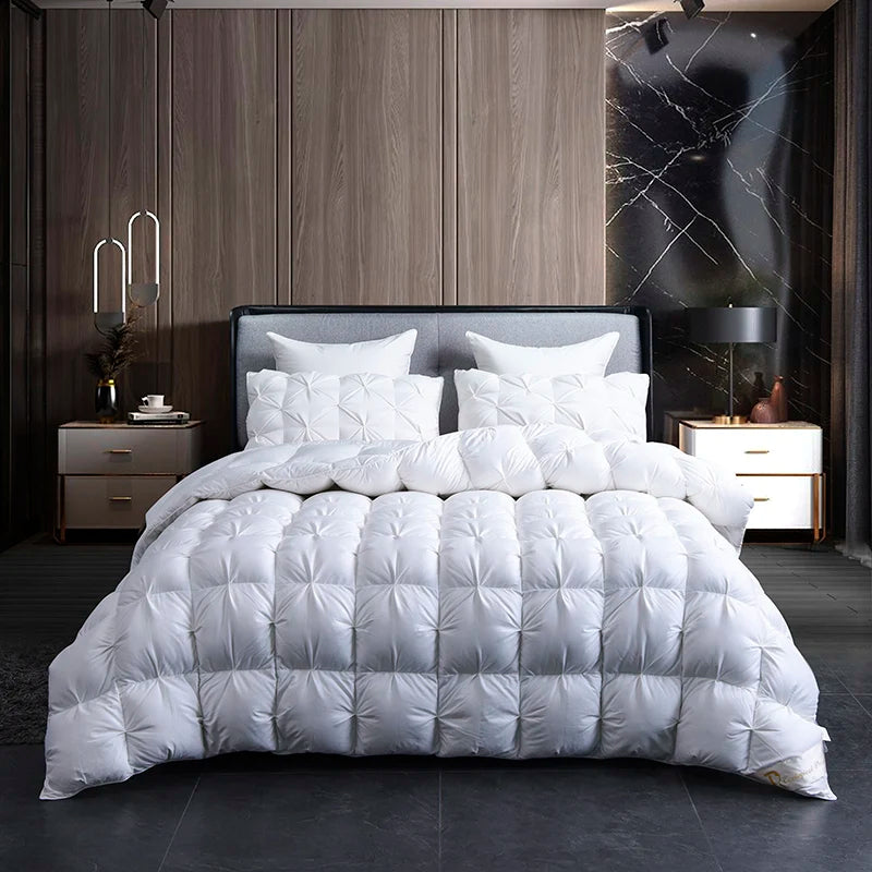 A white luxury goose down duvet blanket is displayed on a bed in a modern bedroom setting.