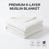 A stack of white 6-layer muslin blankets with an OEKO-TEX certified label.