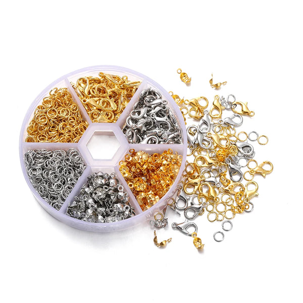 A clear plastic container filled with various gold and silver lobster clasp findings for jewelry making.