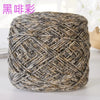 A ball of metallic silk crocheting and knitting yarn with a textured, woven appearance.