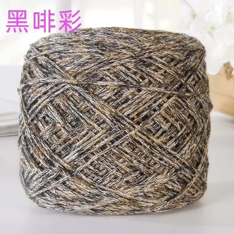 A ball of metallic silk crocheting and knitting yarn with a textured, woven appearance.
