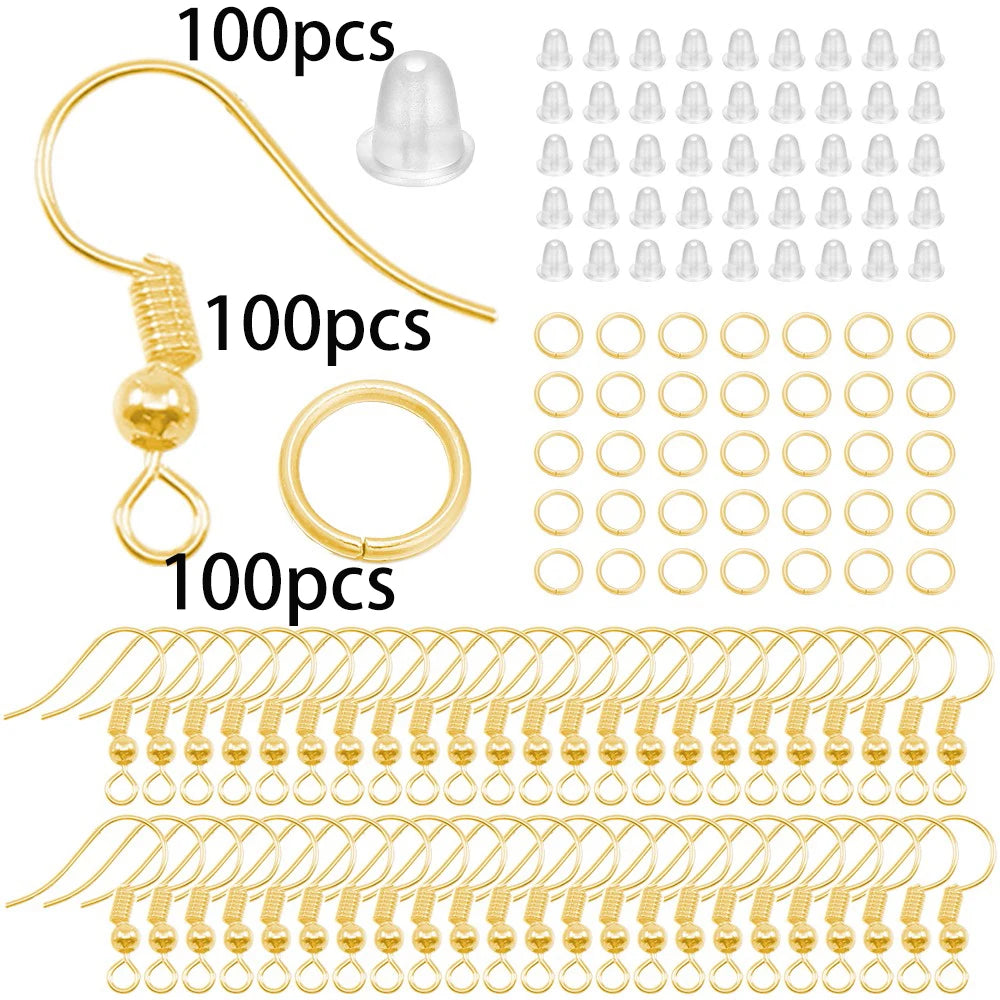 A collection of gold-colored lobster clasp findings, including individual pieces and bulk strands for jewelry making.
