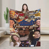 A colorful blanket featuring various young women and stars, suitable for winter comfort.