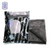 A package of black and white striped coral fleece microfiber cleaning cloths.
