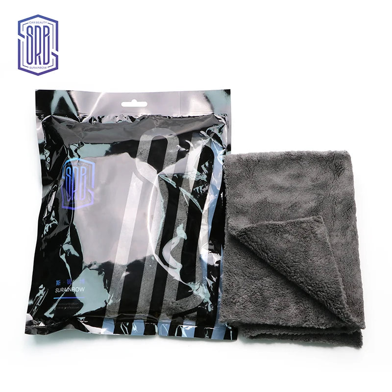 A package of black and white striped coral fleece microfiber cleaning cloths.