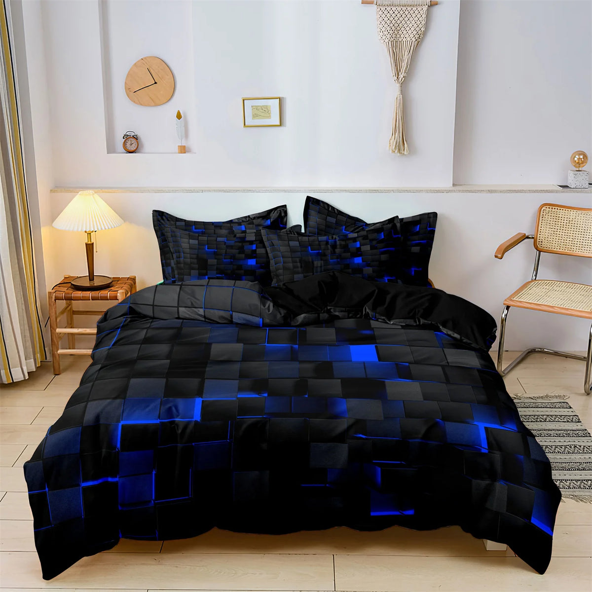 A black and blue geometric grid plaid duvet cover set displayed on a bed in a bright room.