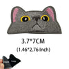 Gray cat face embroidered patch with pink ears and yellow eyes