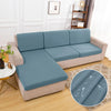 A light blue waterproof sofa cushion protector cover on a beige sofa.