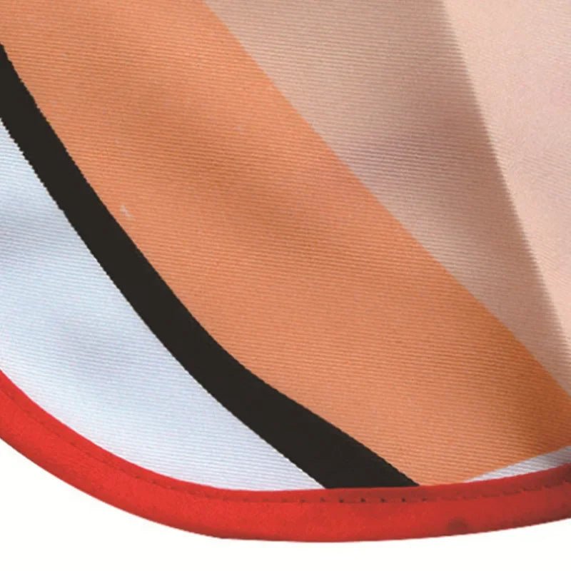 Close-up of an orange and white striped apron fabric with a black trim.