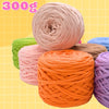 A collection of various colored craft yarn spools, including pink, orange, green, and purple, displayed against a yellow back